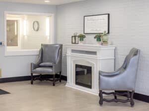 seating area and fireplace at presidential post acute